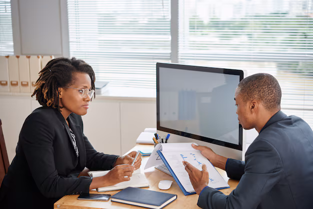 afro american man suit holding documents talking female boss 1098 20604